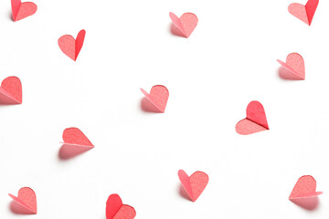 Wall Mural - Hearts cut out from white paper. Festive background for valentine's day.