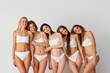 © master1305 - Well-being, self-love. Comfort. Group portrait of beautiful tender young women posing in underwear over grey studio background. Natural beauty, diversity, body and skin care, spa, wellness concept.
