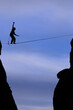 © Cavan Images - A man balances on a slack line.