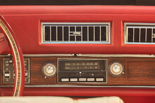 Old Car Radio Inside A Red Classic American Car With Chrome And Wooden Dashboard