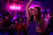 © bernardbodo - Caucasian woman dancing at concert