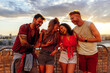 © bernardbodo - Friends laughing in sunset at festival