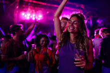 Caucasian Woman Dancing At Concert