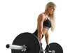 © USM Photography - Fitness woman portrait. Confident looking female bodybuilder squats with barbell.