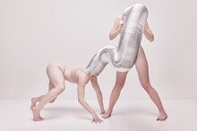 Domination. Creative Photography With Two Young Girls Posing In Nude Underwear Over Beige Studio Background. Concept Of Cringe, Queer, Art Photography, Weird People, Creativity