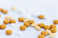 Scattered Orange And White Medical Pills  For Nausea And Pain Relief