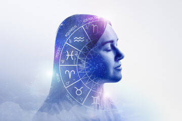 astrological forecast. silhouette of a young girl in profile with signs of the zodiac