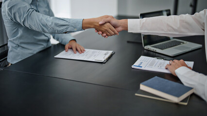 Wall Mural - Business man Successful Ideas team shaking hands in Meeting room.