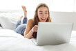 © Louis-Paul Photo - teen with laptop on bed
