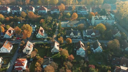 Aerial view of solar panels installed on the roofs of country houses in a modern city. Aerial view of a modern photovoltaic power supply system for buildings. 