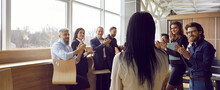 Successful People Office Workers Applaud Female Employee Of Company Or Branch Manager Standing With Back To Camera And Rejoice At New Person In Team Be In Spacious Bright Room. Business Concept