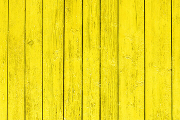 Wall Mural - Old peeling paint texture. Grunge cracked wooden wall background. Yellow color weathered surface. Broken wood desk structure. Vintage board pattern design.