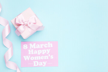 Canvas Print - Card with text 8 March Happy Women's Day, ribbon and gift box on blue background