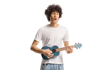 Sticker - Young cheerful man with curly hair playing ukulele and singing