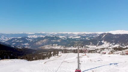 Wall Mural - Goderdzi, Georgia - 17th january, 2023: panoramic view winter ski resort Goderdzi with cable way car operate in sunny day with caucasus background and clear skies.