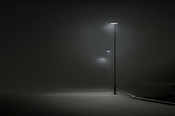 streetlight on a foggy and dark parking lot