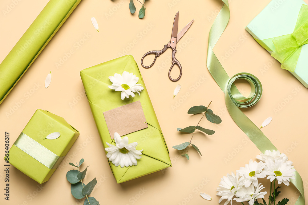 Composition with beautiful gift boxes, wrapping paper, ribbon and flowers on color background. Women's Day celebration