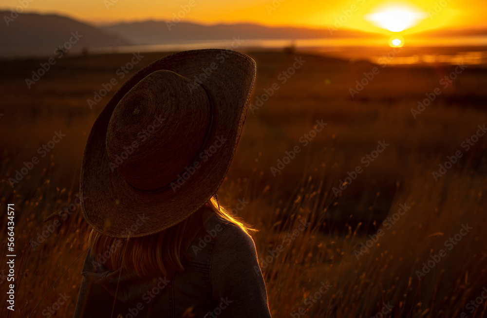 Little Girl Wearing a Cowboy Hat Standing in a Field of Wheat and ...