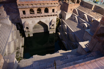 Wall Mural - Toorji's Step Well, Toorji ki Jhalara, Toorj ki jhalra, was built in 1740s.Hand carved step well bulit to provide water to the local people in the desert. Ancient architecture Jodhpur,Rajasthan,India.