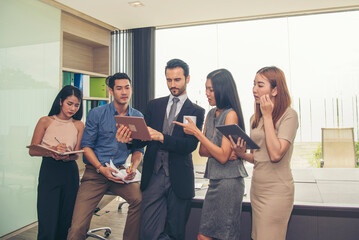 Poster - Happy business people meeting present graph chart investment, business data in meeting room. Group of business people meeting in conference room. Asian businessman speech, present teamwork partnership