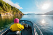 © Maridav - Woman Driving Motor Boat in Amazing Nature Landscape at Sunset in Coastal British Columbia Near Bute, Toba Inlet and Campbell River. Whale Watching Tourist Travel Destination, Canada