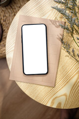 Poster - mockup blank screen mobile on round table with sunlight