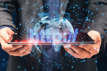 Wall Mural - Close up of businessman hand holding tablet with glowing globe hologram on blurry background. Internet, big data, seo, security, web and technology concept. Double exposure.