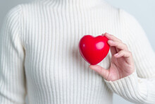 Woman Hand Holding Red Heart Shape. Love, Donor, World Heart Day, World Health Day And Insurance Concepts