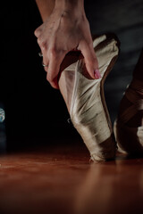 Ballerina. Legs of a ballerina on pointe shoes close-up on a background. Classic and modern. pointe shoes