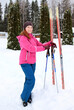 © sanek70974 - a woman with skis in winter