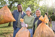 © N Felix/peopleimages.com - Volunteer group portrait, community service and cleaning park with garbage bag for clean environment. Happy man and women helping with trash for eco friendly lifestyle and recycling outdoor in nature