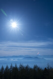 Fototapeta  - Japan mountain range in hazy blue sunshine.