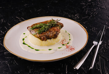 Wall Mural - steak with rosemary on mashed potatoes