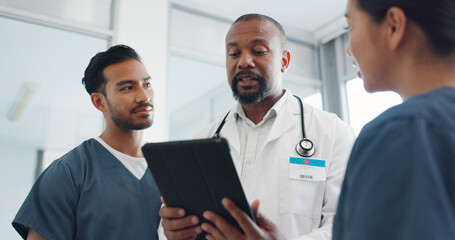 Wall Mural - Tablet, doctor and nurses conversation, communication and online research in hospital. Black man, medical professional or staff talking, digital schedule for surgery or smile for results or diagnosis