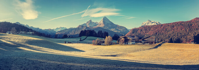 Fototapete - Scenic nature scenery in Bavarian alps. view on green grasslands meadow with rocky peak mountains on horizon background, mountain valley landscape and rural countryside. artistic instagram filter.