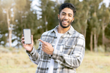 Poster - Mockup, phone and portrait of man in nature or forest with mobile app, product placement or 5g technology promotion. Happy person, hand holding smartphone and space, mock up and screen in a park