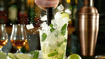 Poster - Preparation of mojito drink on bar counter.