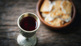 Fototapeta  - Concept of Eucharist or holy communion of Christianity. Eucharist is sacrament instituted by Jesus. during last supper with disciples. Bread and wine is body and blood of Jesus Christ of Christians.