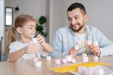 Cute Child Girl With Father Playing And Creating With Marshmallows And Spaghetti. Child Concentrated With  Building A Molecule Model. Focus On Girl.