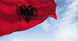 Close-up view of the Albanian national flag waving in the wind
