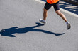 © sports photos - legs male running race. silhouette runner on asphalt