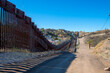 United States Mexico Border Wall between Nogales Arizona and Nogales Sonora on International Street in city of Nogales, Arizona AZ, USA. 
