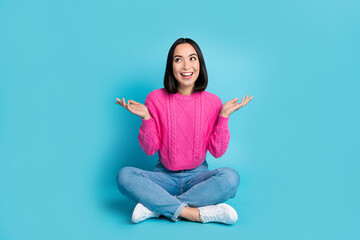 Wall Mural - Full length photo of adorable excited lady wear pink pullover looking empty space isolated blue color background