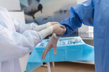 Preparing and putting on gloves before surgery