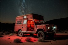 A Classic 1990 Land Rover Defender 90 In The Middle Of The Desert At Night, Image Created With Generative AI Technology.