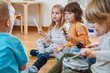 © lordn - Preschool children with instruments in a music class