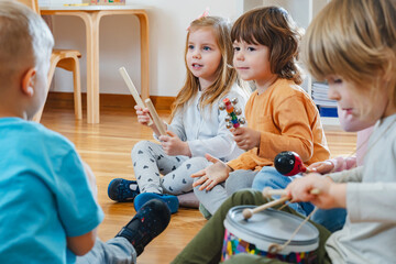 Preschool children with instruments in a music class