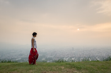 Wall Mural - traveling asian mature woman walking