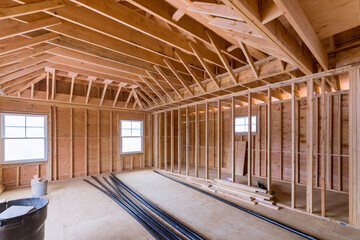 Wall Mural - Fragment view beams stick built of new home under construction wood framing beam framework