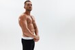 © SHOTPRIME STUDIO - Man athletic body bodybuilder in briefs with naked torso abs full-length in the background, fitness classes. Advertising, sports, active lifestyle, competition, challenge concept.